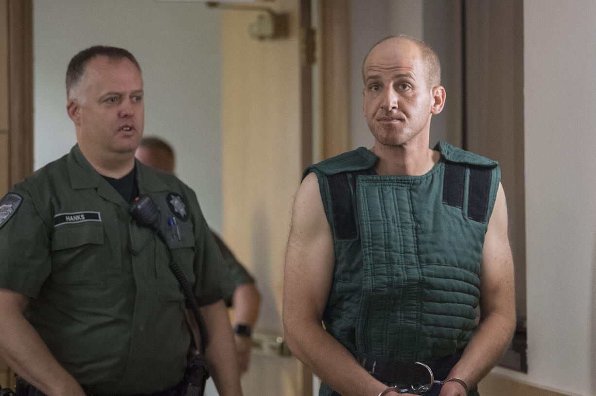 Dustin L. Zapel, 35, the suspect in a double-homicide in Vancouver, prepares to make a first appearance in Clark County Superior Court on Monday morning, July 17, 2017.