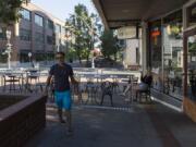 Musician Tony Smiley walks around Top Shelf in downtown Vancouver before his performance at the bar on Friday evening.