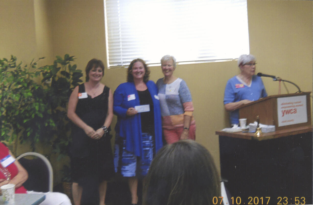 Hough: From left: Second Step Housing’s Mary Hopkins and Shauna McCloskey, board president, accept a check for $4,077 from Clark County Newcomers Club’s Sally Morello, charity chairwoman, and Gladys Green, president.