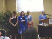 Hough: From left: Second Step Housing’s Mary Hopkins and Shauna McCloskey, board president, accept a check for $4,077 from Clark County Newcomers Club’s Sally Morello, charity chairwoman, and Gladys Green, president.