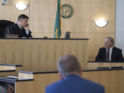 Judge Bernard Veljacic, left, talks with John Jones, a contract security company manager, as he testifies in an evidentiary hearing in a public records lawsuit on Monday morning. Veljacic ruled in favor of releasing footage from jail surveillance cameras that captured the incident that led to the 2015 death of Mycheal Lynch, an inmate at the jail.