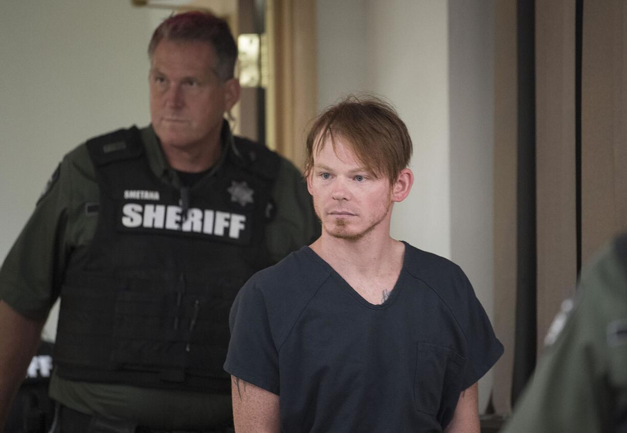 Clark County Corrections Deputy Christopher A. North, front, who was arrested Wednesday for alleged sexual misconduct with a female inmate at the Clark County Jail, makes a first appearance in Superior Court on Thursday morning, July 27, 2017.