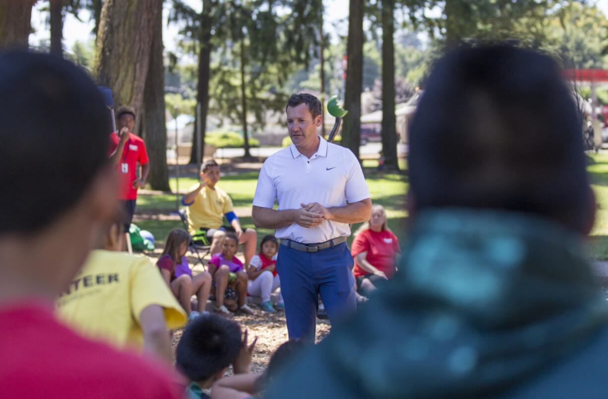 Vancouver Mayor Tim Leavitt answers kids’ questions Friday at Evergreen Park as part of the Summer Playgrounds Program in Vancouver.