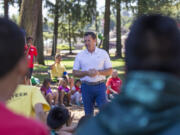 Vancouver Mayor Tim Leavitt answers kids’ questions Friday at Evergreen Park as part of the Summer Playgrounds Program in Vancouver.