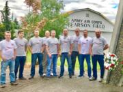 Simon Ross, third from right, with other members of a Seattle-area car club that collects Soviet-era vehicles at the monument to the Chkalov flight near Pearson Air Museum on June 20.