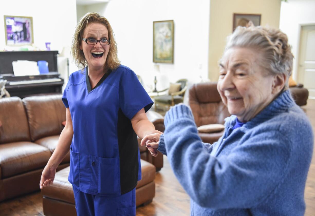 Caregiver Juli Colson, left, dances to Elvis music with Angelbrook Senior Living Adult Care Home resident, Annetta Houseman, Thursday June 29, 2017. Every day before lunch at Angelbrook, Colson turns on music by Elvis Presley, which brightens Housemans mood and inspires her to dance.