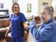 Caregiver Juli Colson, left, dances to Elvis music with Angelbrook Senior Living Adult Care Home resident, Annetta Houseman, Thursday June 29, 2017. Every day before lunch at Angelbrook, Colson turns on music by Elvis Presley, which brightens Housemans mood and inspires her to dance.