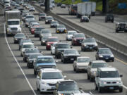 Traffic heads north (left) and south (right) in Portland on Interstate 5 in April 2015. Oregon has moved closer to passing a transportation package that could bring rush-hour tolls to I-5 and I-205.