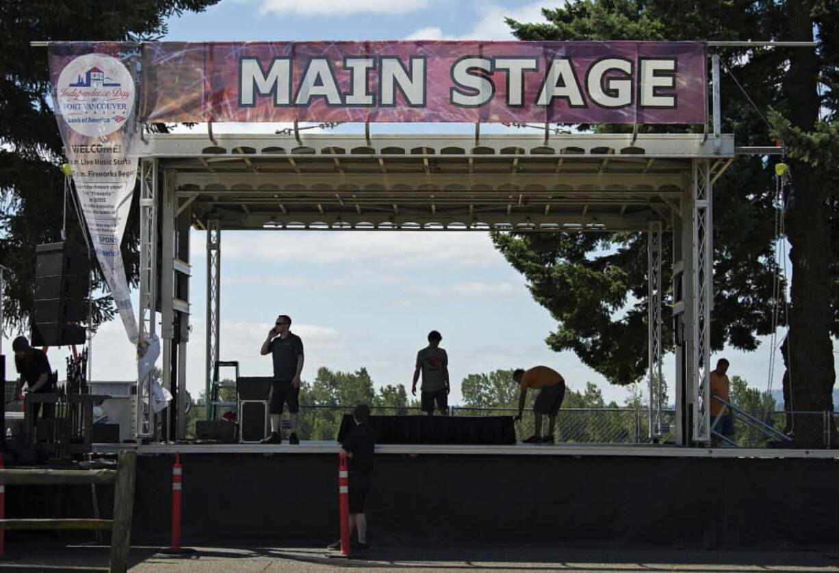 Workers from Wager Audio set up the main stage Monday morning along East Fifth Street in preparation for Tuesday’s Fourth of July festivities at Fort Vancouver National Historic Site.