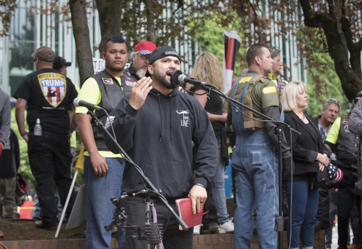 Local political activist Joey Gibson speaks at a rally he helped organize in Portland June 4. Gibson rejects most political labels, preferring conservative-libertarian.