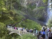 Crowds fill bridges and trails at Multnomah Falls Recreation Area, Friday May 26, 2017.