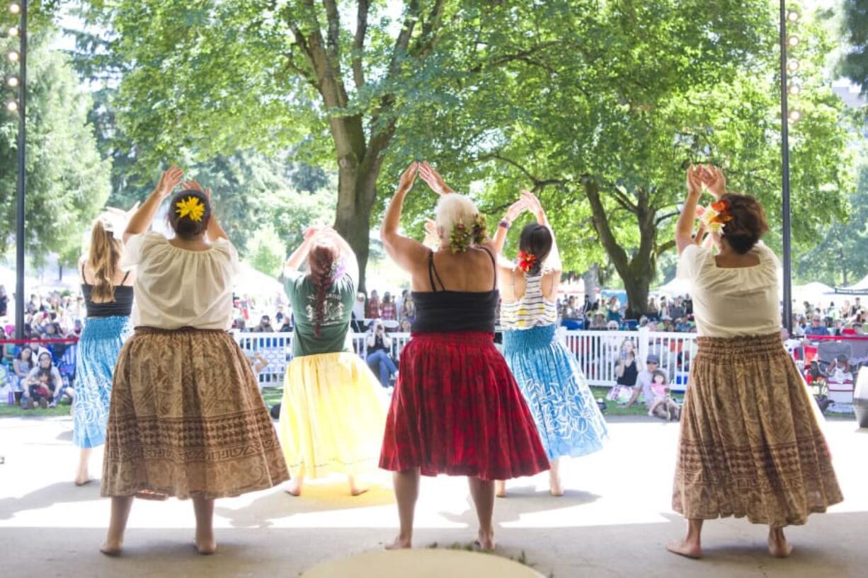 Dancers perform a routine learned at a workshop during the final day of the Three Days of Aloha festival at Esther Short Park on July 30, 2016.