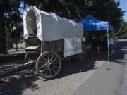 Clark Public Utilities workers get their water wagon ready Monday morning along East Fifth Street at Fort Vancouver National Historic Site.