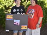 Washougal: Jemtegaard Middle School seventh-grader Adel Cathey, left, and Dani Allen, Jemtegaard art teacher, with Adel’s three watercolor sunset paintings, which district staffers honored her for by hanging them in the district office.