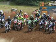 A cluster of motorcycles are seen at the start of the 250 cc race in the Washougal MX National in Washougal Saturday July 23, 2016.