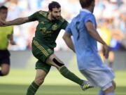 Portland Timbers midfielder Diego Valeri scores a goal during the first half of an MLS soccer match against Sporting Kansas City in Kansas City, Kan., Saturday, July 1, 2017.