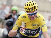 Britain's Chris Froome, wearing the overall leader's yellow jersey celebrates his overall victory during the final stage of the Tour de France cycling race over 103 kilometers (64 miles) with start in Montgeron and finish in Paris, France, Sunday, July 23, 2017.