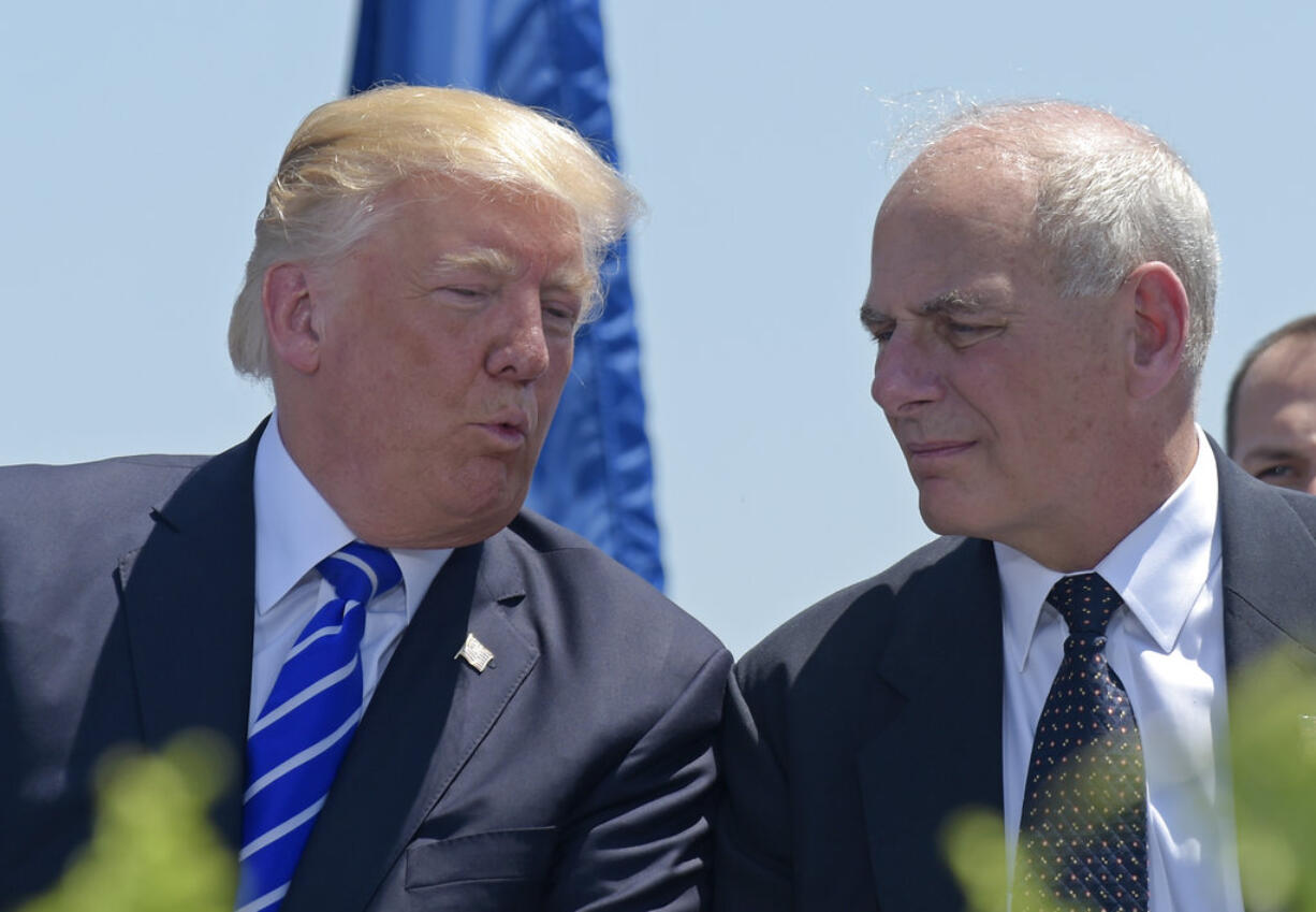 FILE - In this May 17, 2017, file photo, President Donald Trump talks with Homeland Security Secretary John Kelly during commencement exercises at the U.S. Coast Guard Academy in New London, Conn. Trump named Kelly as his new Chief of Staff on July 28, ousting Reince Priebus.