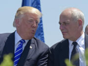 FILE - In this May 17, 2017, file photo, President Donald Trump talks with Homeland Security Secretary John Kelly during commencement exercises at the U.S. Coast Guard Academy in New London, Conn. Trump named Kelly as his new Chief of Staff on July 28, ousting Reince Priebus.