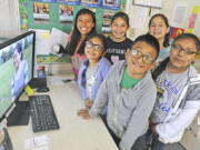 Jefferson Elementary School students, from left, Gladys Espinoza, Anahi Villa, Suri Valles, Samuel Solano, Kimberly Madera and Jizlinn Martinez-Cruz play a video they made about growing up in a bilingual world June 8 in Mount Vernon. The students hope that their stories will inspire others.