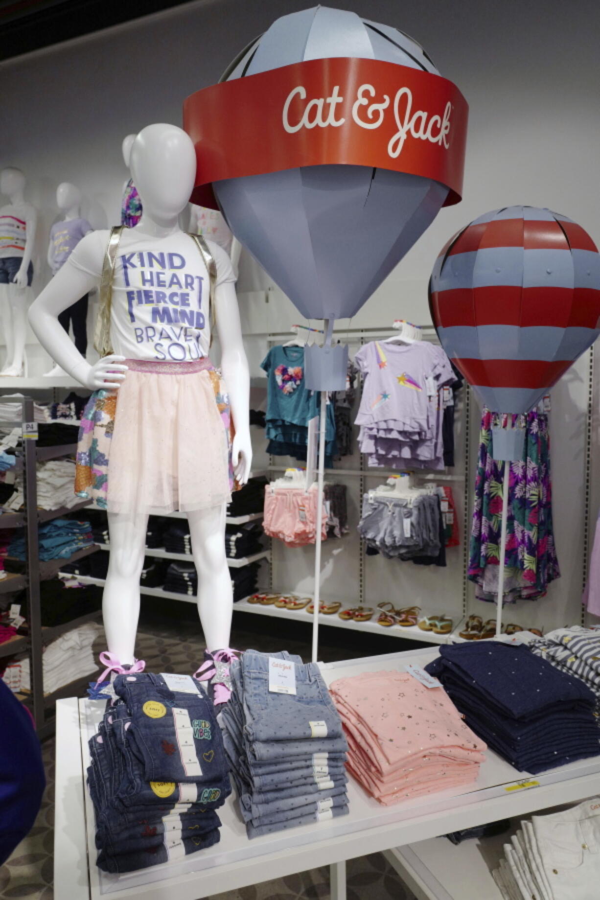 Cat & Jack jeans and T-shirts are displayed at a Target store in New York. The clothes are made with Repreve polyester fabric, created from recycled plastic bottles.