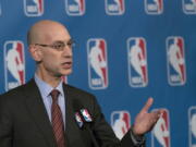 FILE - In this Oct. 21, 2016, file photo, NBA Commissioner Adam Silver speaks to reporters during a news conference, in New York. The NBA is trying to make games go a little more quickly. The league's Board of Governors has unanimously approved some changes that will potentially eliminate four time-outs per game, help speed up the final minutes of games and emphasize a timely resumption of play after halftime.