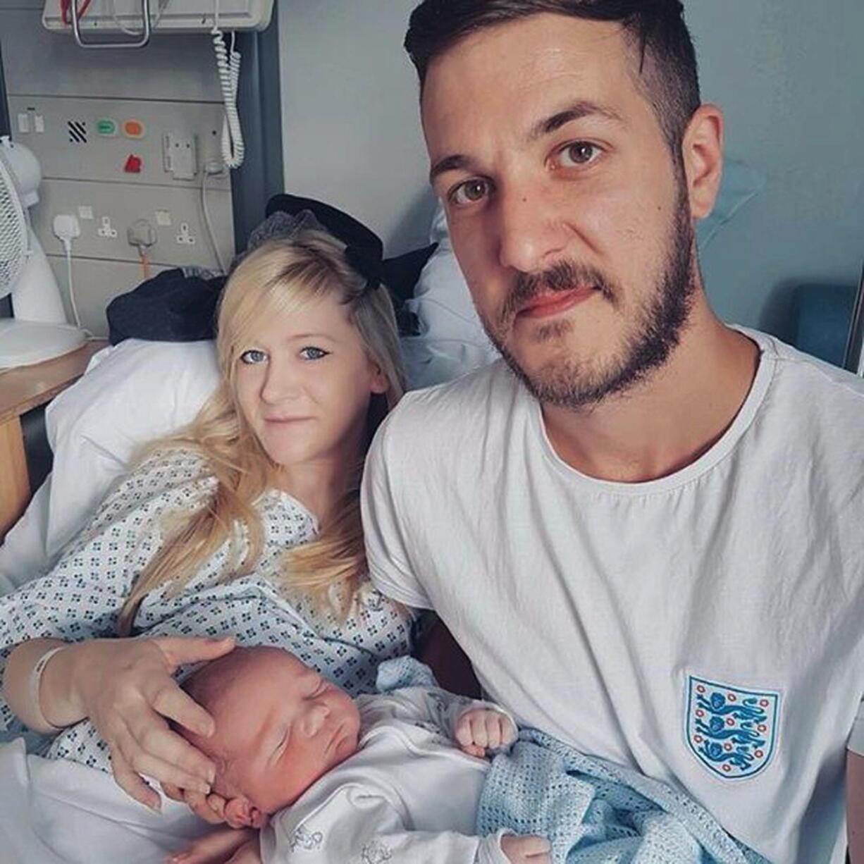 This is an undated hand out photo of Chris Gard and Connie Yates with their son Charlie Gard provided by the family, at Great Ormond Street Hospital, in London. The president of the United States has offered to help. The pope is willing to have the Vatican hospital take him in. Some 1.3 million pounds ($1.68 million) have been raised to help him leave Britain for treatment. But little has changed Tuesday July 4, 2017, for Charlie Gard, a terminally-ill British infant suffering from a rare genetic disease that has left him severely brain damaged.