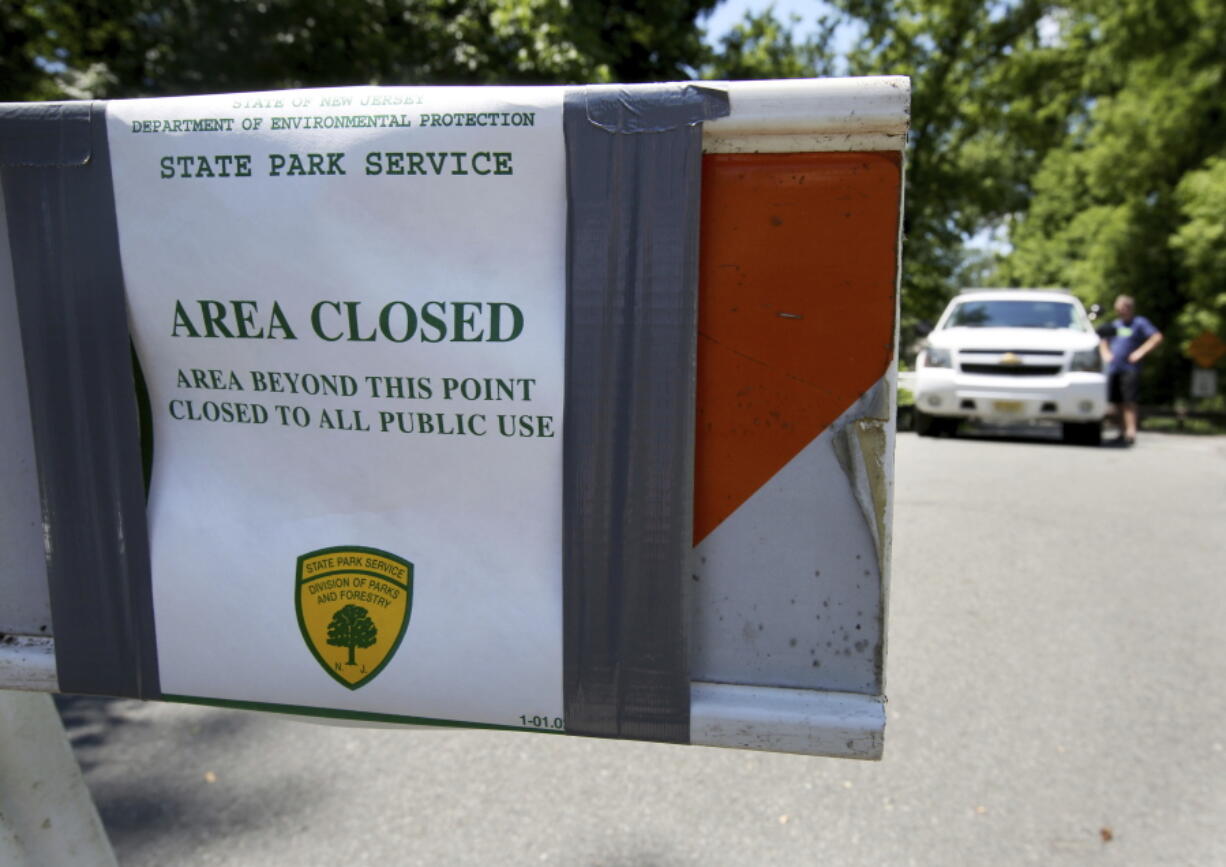 New Jersey State Park police block the entrance to Bulls Island state recreation area during the state government shutdown in Stockton, N.J. , Sunday, July 2, 2017. New Jersey’s government shutdown dragged into a second day Sunday without a resolution to the stalemate between a defiant Republican Gov. Chris Christie and an unmoving Democratic Assembly Speaker Vincent Prieto.