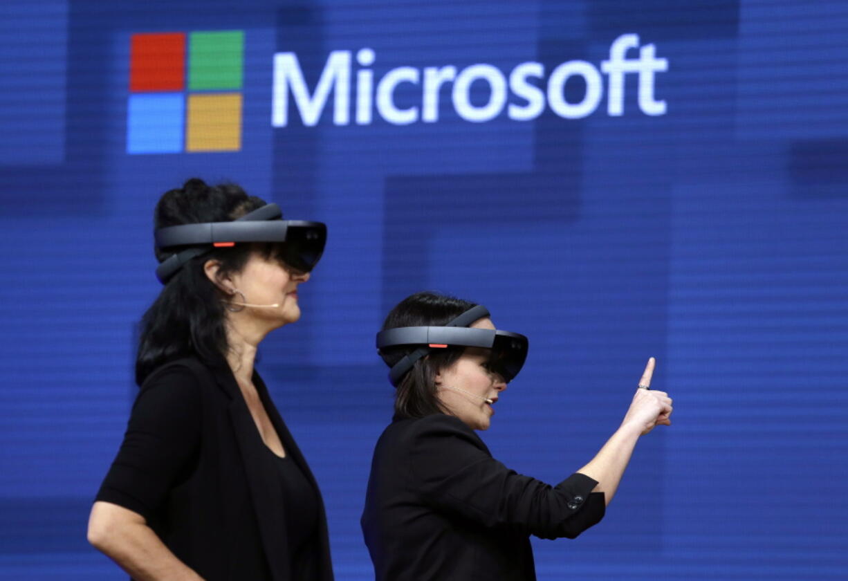 Members of a design team at Cirque du Soleil demonstrate use of Microsoft’s HoloLens device in helping to virtually design a set at the Microsoft Build 2017 developers conference May 11 in Seattle.