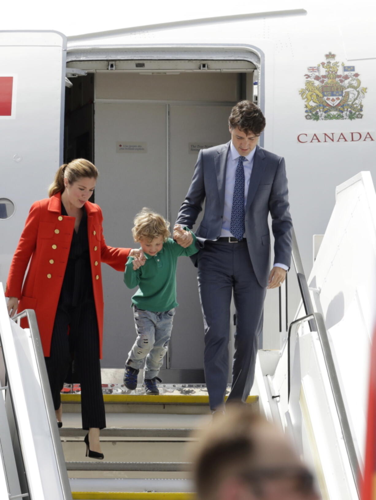 Sophie Gregoire-Trudeau, son Hadrien, and Canada’s Prime Minister Justin Trudeau, from left, arrive for the G-20 summit in Hamburg, northern Germany, on Thursday. The leaders of the group of 20 meet July 7 and 8.