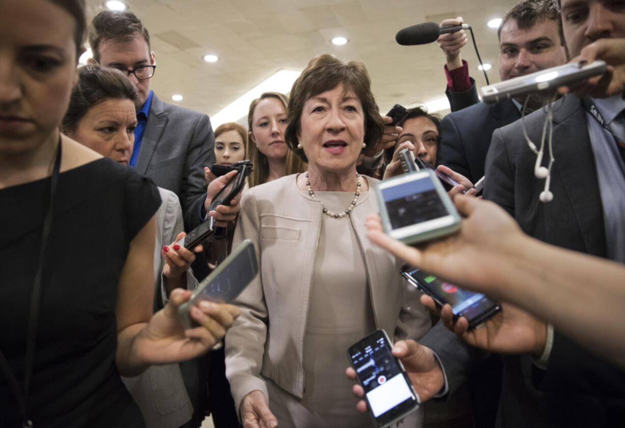 Sen. Susan Collins, R-Maine is surrounded by reporters Tuesday as she arrives on Capitol Hill in Washington, before a test vote on the Republican health care bill. Collins, who was one of three Republican senators voting against the GOP health bill on Friday said she’s troubled by Trump’s suggestions that the insurance payments are a “bailout.” (AP Photo/J.