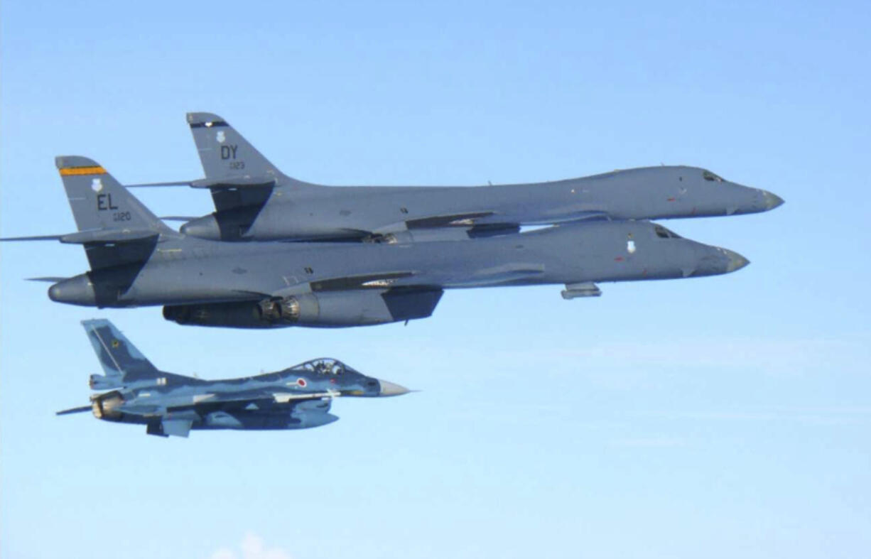 In this photo released by Japan Air Self Defense Force, U.S. Air Force B-1B bombers, top, fly with a Japan Air Self Defense Force F-2 fighter jet over Japan’s southern island of Kyushu, just south of the Korean Peninsula, during a Japan-U.S. joint exercise Sunday, July 30, 2017. Japan’s Defense Ministry reported the U.S. supersonic bombers flown from the Anderson Air Force Base in Guam conducted a joint exercise with South Korean Air Force over the Korean Peninsula later in the day. The U.S. Pacific Air Forces said in a statement that the mission was a response to consecutive intercontinental ballistic missile tests by North Korea this month.