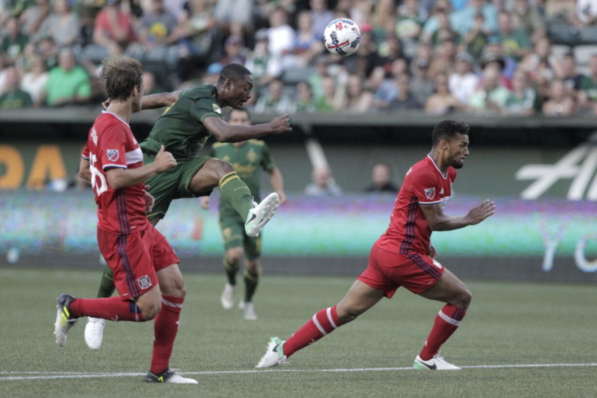 Portland Timbers' Fanendo Adi (9) fires a shot on goal against the Chicago Fire during an MLS soccer match Wednesday, July 5, 2017, in Portland, Ore.