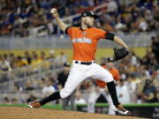 Miami Marlins relief pitcher David Phelps was traded to the Seattle Mariners for four prospects, including highly regarded outfielder Brayan Hernandez on Thursday, July 20, 2017.