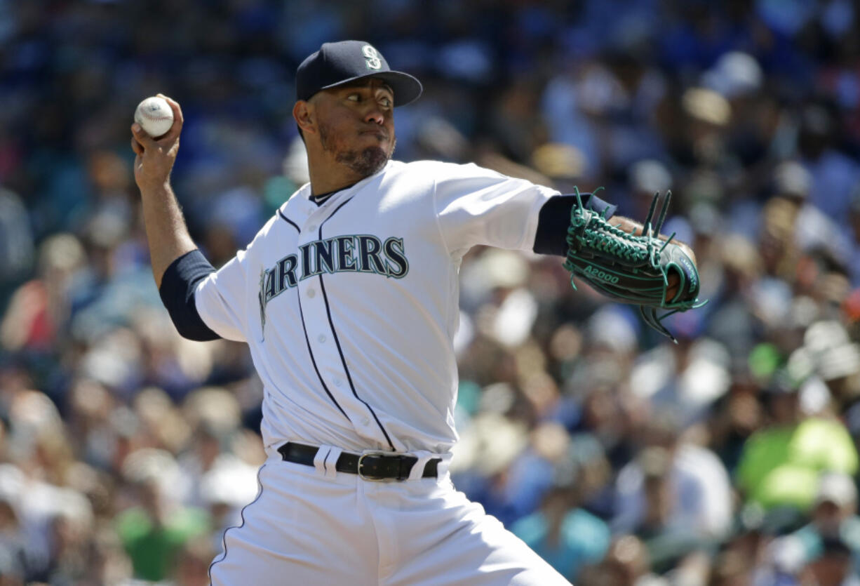 Seattle Mariners starting pitcher Yovani Gallardo throws against the New York Mets in the first inning of a baseball game, Saturday, July 29, 2017, in Seattle. (AP Photo/Ted S.