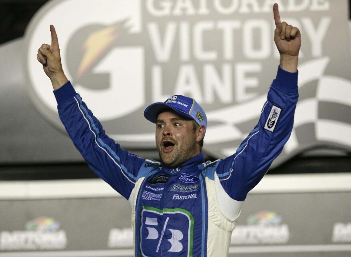 Ricky Stenhouse Jr. celebrates in Victory Lane after winning the NASCAR Cup auto race at Daytona International Speedway, Saturday, July 1, 2017, in Daytona Beach, Fla.