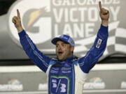 Ricky Stenhouse Jr. celebrates in Victory Lane after winning the NASCAR Cup auto race at Daytona International Speedway, Saturday, July 1, 2017, in Daytona Beach, Fla.