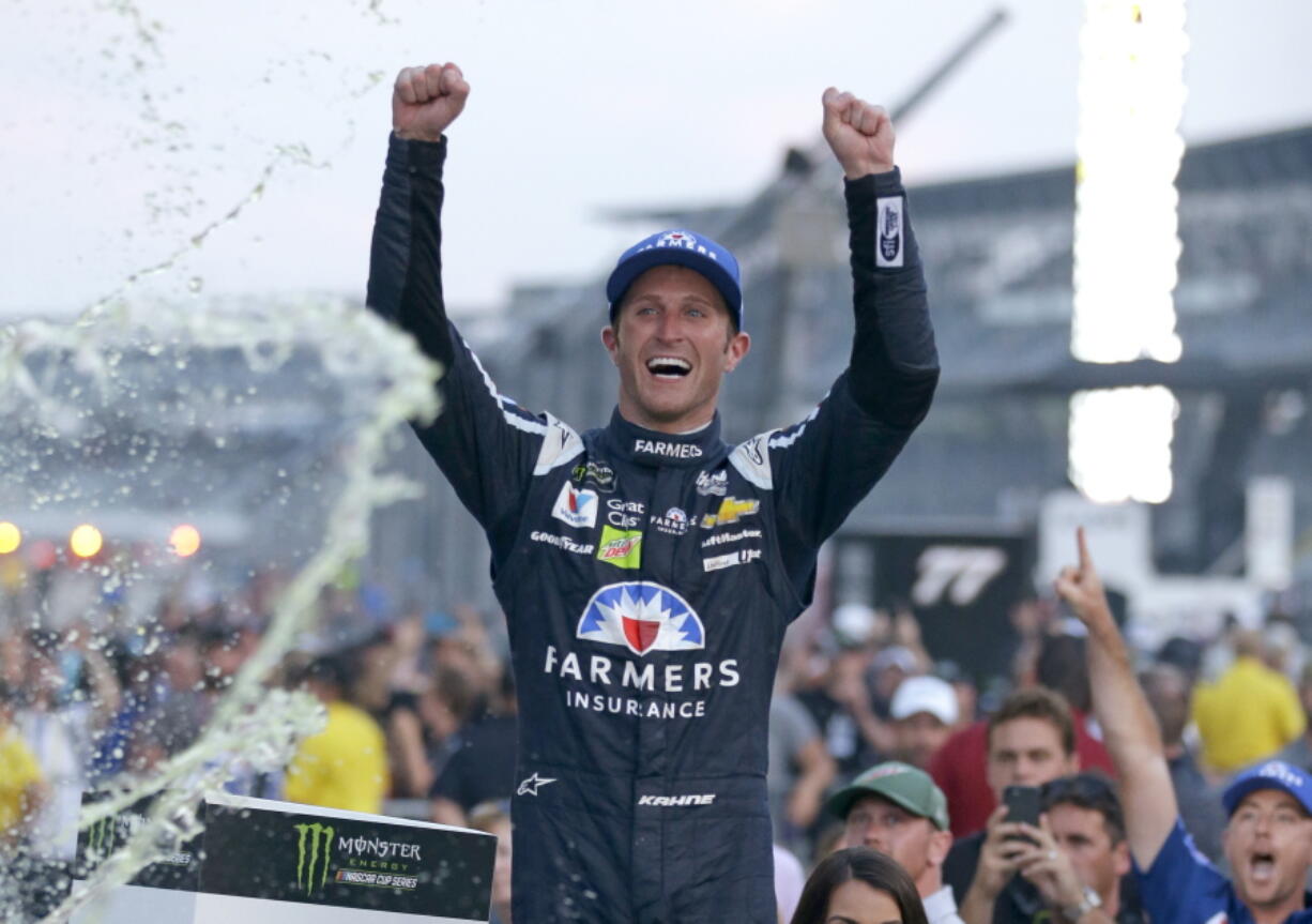 Kasey Kahne (5) celebrates winning the NASCAR Brickyard 400 auto race at Indianapolis Motor Speedway in Indianapolis, Sunday, July 23, 2017.