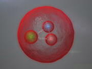 This image provided by CERN shows an artist’s conception of a new subatomic particle.