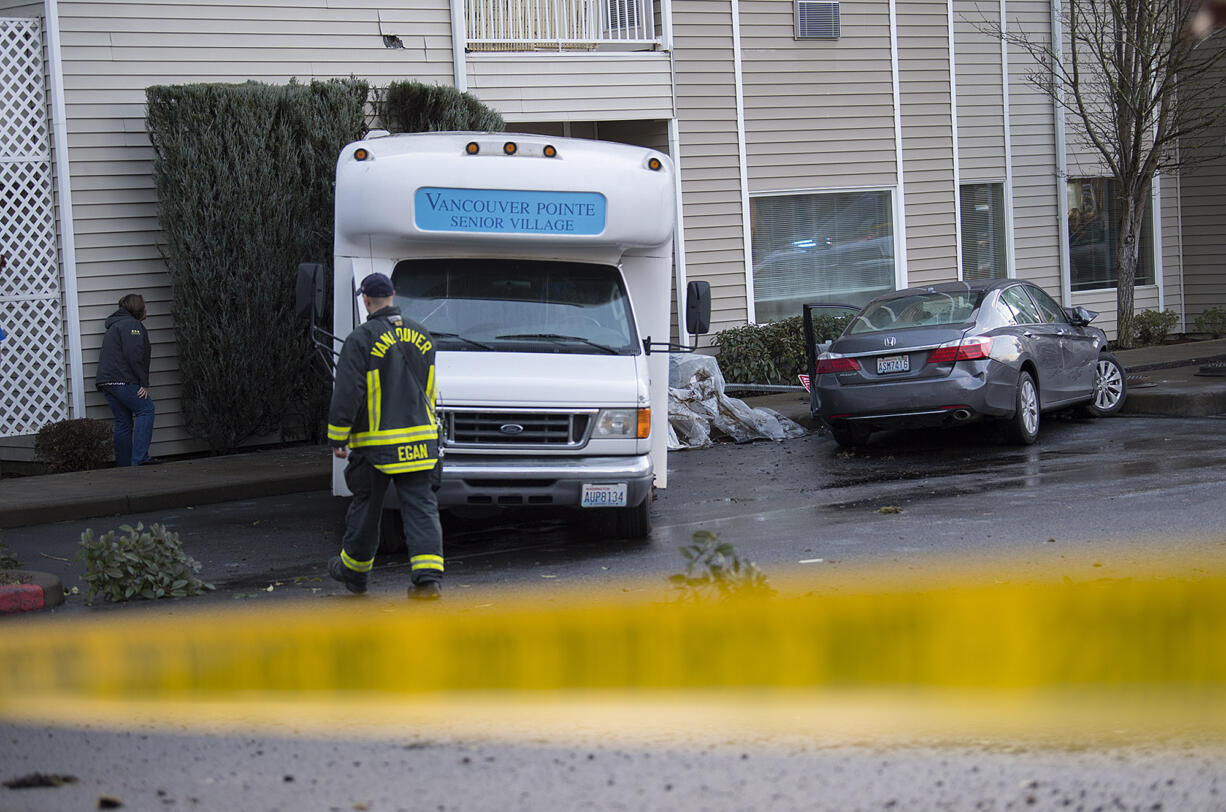 Firefighters and onlookers check out the scene at Vancouver Pointe Senior Village on Friday morning, Feb. 10, 2017.