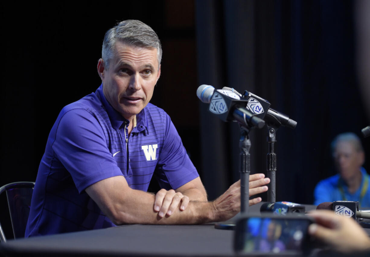 Washington head coach Chris Petersen speaks at the Pac-12 NCAA college football media day, Wednesday, July 26, 2017, in the Hollywood section of Los Angeles. (AP Photo/ Mark J.