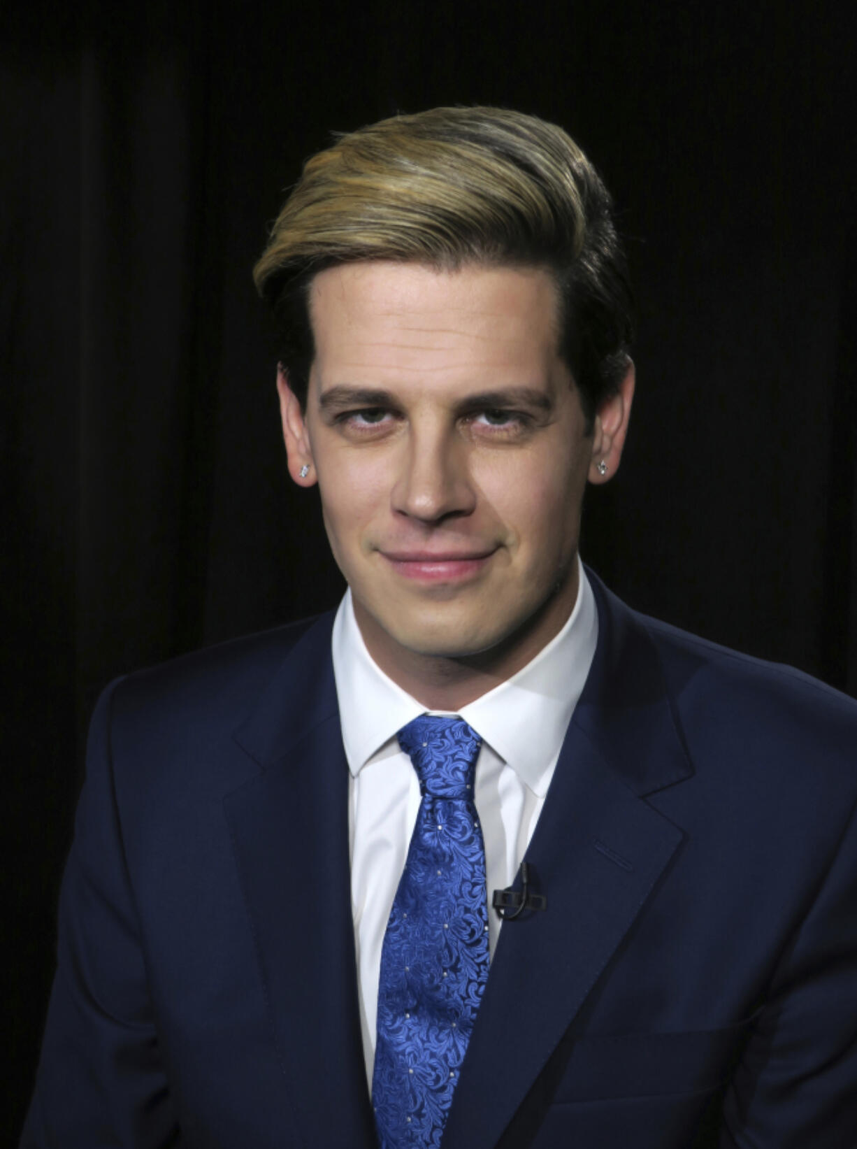 Media personality and author Milo Yiannopoulos appears during an interview in New York on Tuesday, July 18, 2017, to promote his autobiography, “Dangerous.” (AP Photo/John Carucci)