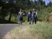 Amy Bounds’ husband, Jeff, uses a wheelchair, so she’s on the lookout for places they can go on family outings. Bounds, right, and two of her children, Rebecca, 15, and Ian, 17, checked out the Salmon Creek Greenway and Trail in Vancouver on July 1. Randy L.