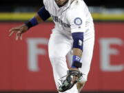 Seattle Mariners second baseman Robinson Cano misplays a grounder from Kansas City Royals’ Lorenzo Cain for an error during the 10th inning of a baseball game Wednesday, July 5, 2017, in Seattle.