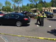 Clark County sheriff's deputies inspect a Honda Accord that struck three pedestrians Saturday.