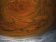 This enhanced-color image made available by NASA shows Jupiter’s Great Red Spot on Monday, July 10, 2017. The image was created using data from the Juno spacecraft during its seventh close flyby of the planet.