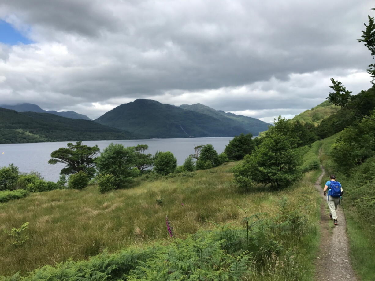 A hiker on the shore of Loch Lomand walks Scotland’s oldest long-distance path, the West Highland Way. Loch Lomand is part of Trossachs National Park and is Britain’s largest body of inland water at 22 miles long. The West Highland Way runs for 95 miles between Milngavie to Fort William, through pastoral landscapes to the rugged beauty of moors and highlands.