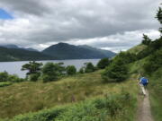 A hiker on the shore of Loch Lomand walks Scotland’s oldest long-distance path, the West Highland Way. Loch Lomand is part of Trossachs National Park and is Britain’s largest body of inland water at 22 miles long. The West Highland Way runs for 95 miles between Milngavie to Fort William, through pastoral landscapes to the rugged beauty of moors and highlands.