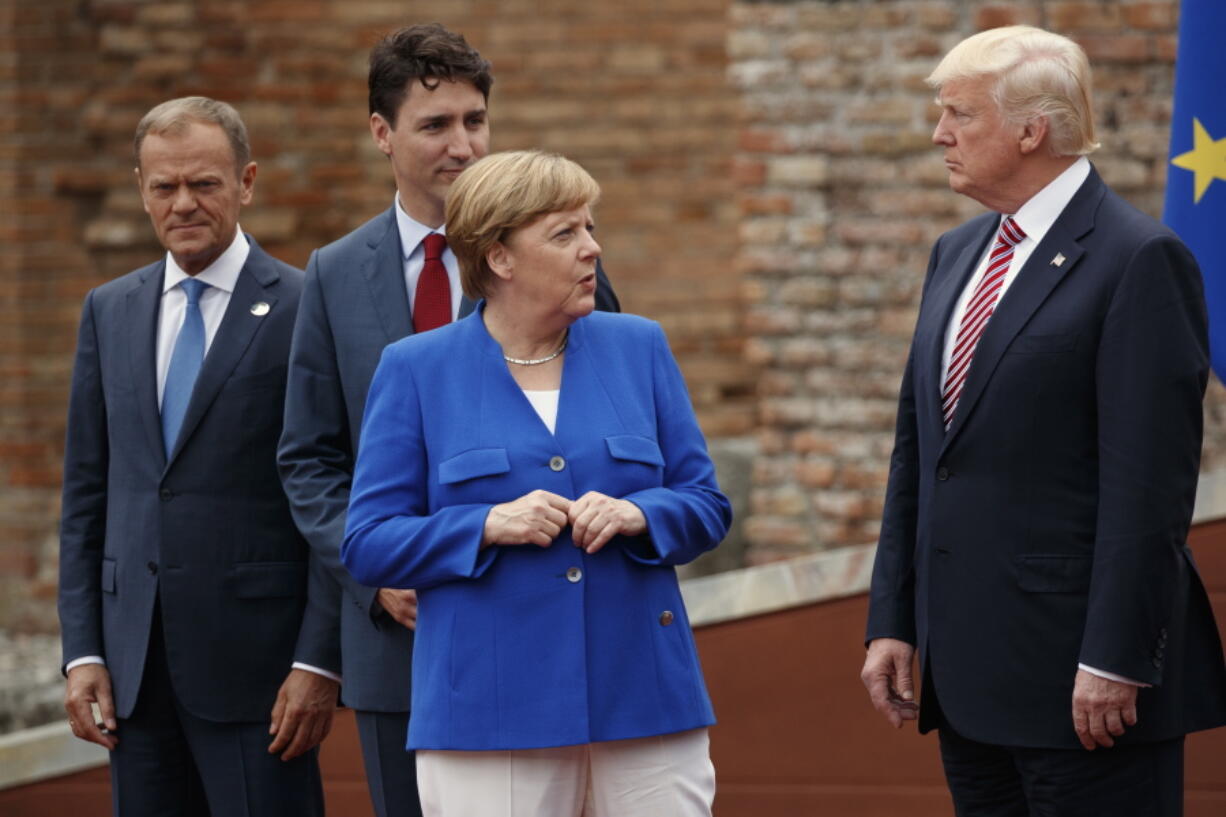 German Chancellor Angela Merkel, accompanied by European Council President Donald Tusk, Canadian Prime Minister Justin Trudeau, talks with President Donald Trump on May 26 during a family photo with G7 leaders at the Ancient Greek Theater of Taormina in Taormina, Italy. President Donald Trump will learn this week whether he gets a second chance to make a first impression as he returns to Europe and has his first encounter with Russia’s Vladimir Putin.