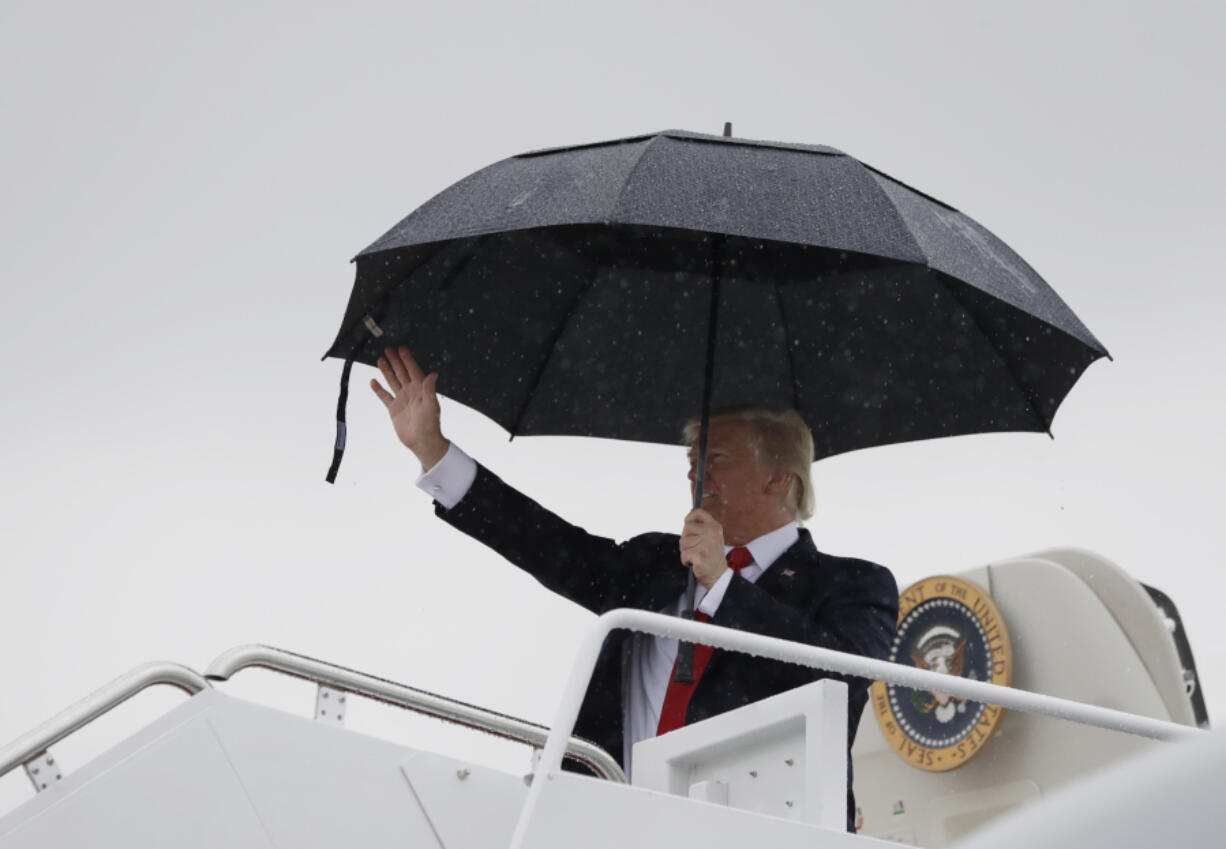 President Donald Trump waves before boarding Air Force One at Andrews Air Force Base, Md., Friday, July 28, 2017, on his way to Brentwood, N.Y. for a speech to law enforcement officials on the street gang MS-13.